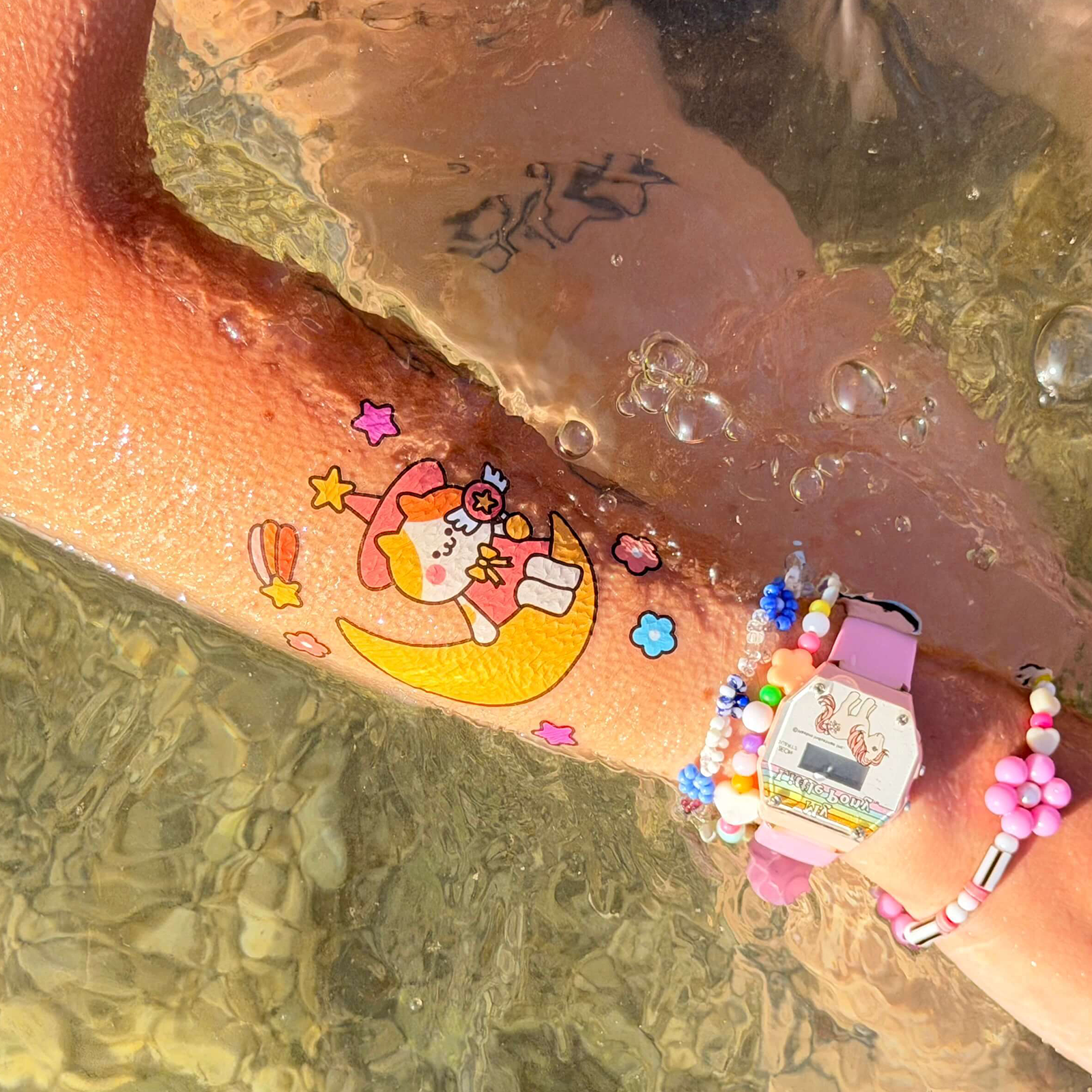 Temporary tattoo on arm in water