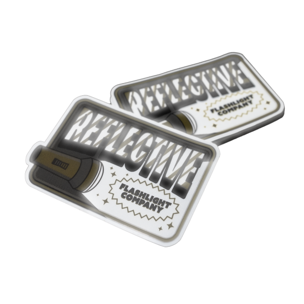Adesivi riflettenti con il disegno di una torcia, testo in grassetto e la scritta 'Flashlight Company'.