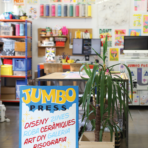 jumbo press's office with stickers, prints and creative workspace